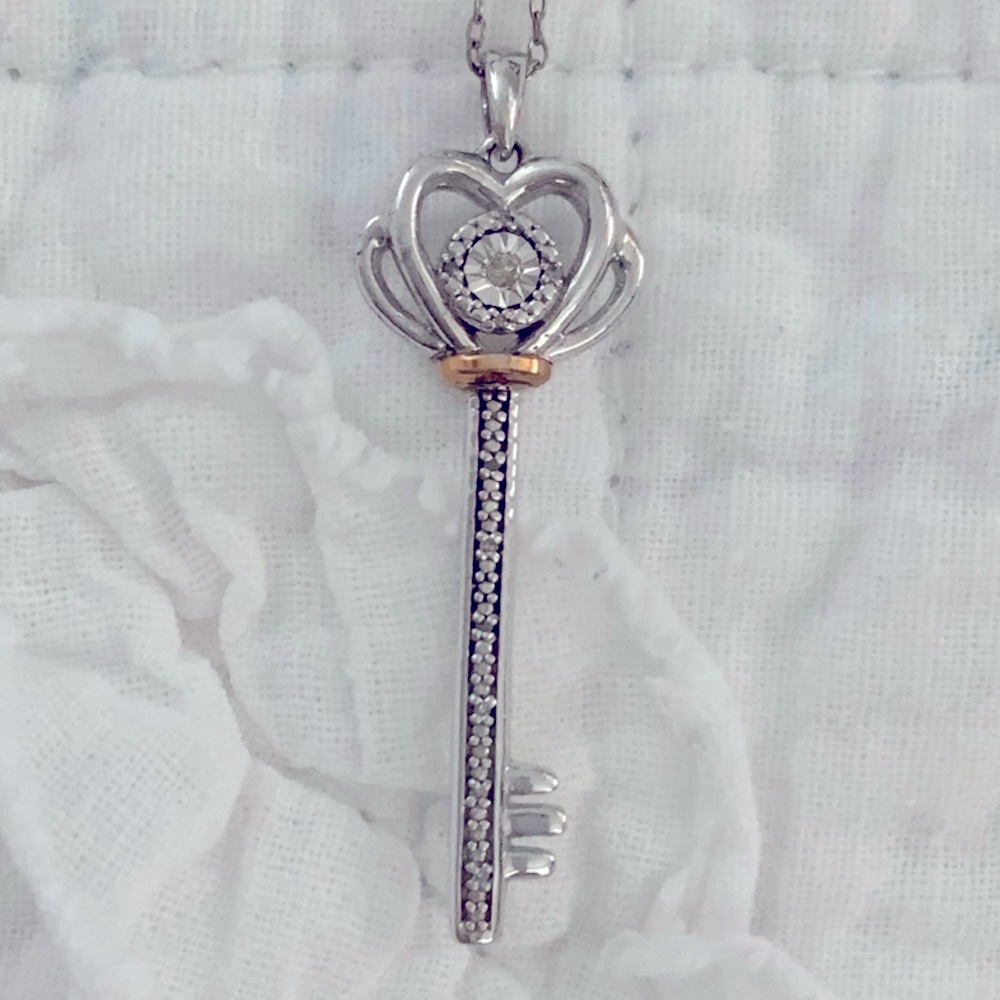 Silver key and chain, artificial diamonds (Macy’s)